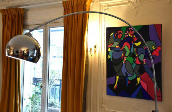 Luxury apartment Rue de Paradis Paris 10th – living room detail with arc lamp and colourful artwork