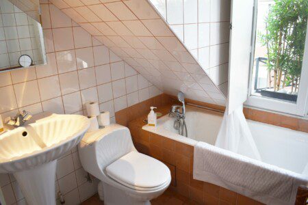 bathroom with tub sink scaled