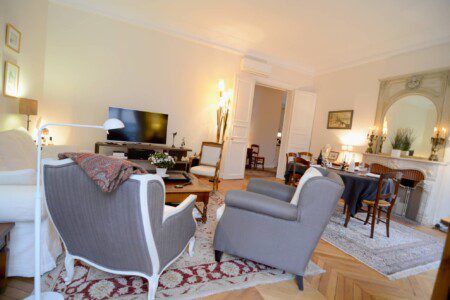 Luxury apartment near Champs-Élysées Paris – spacious living room with Louis XVI armchairs