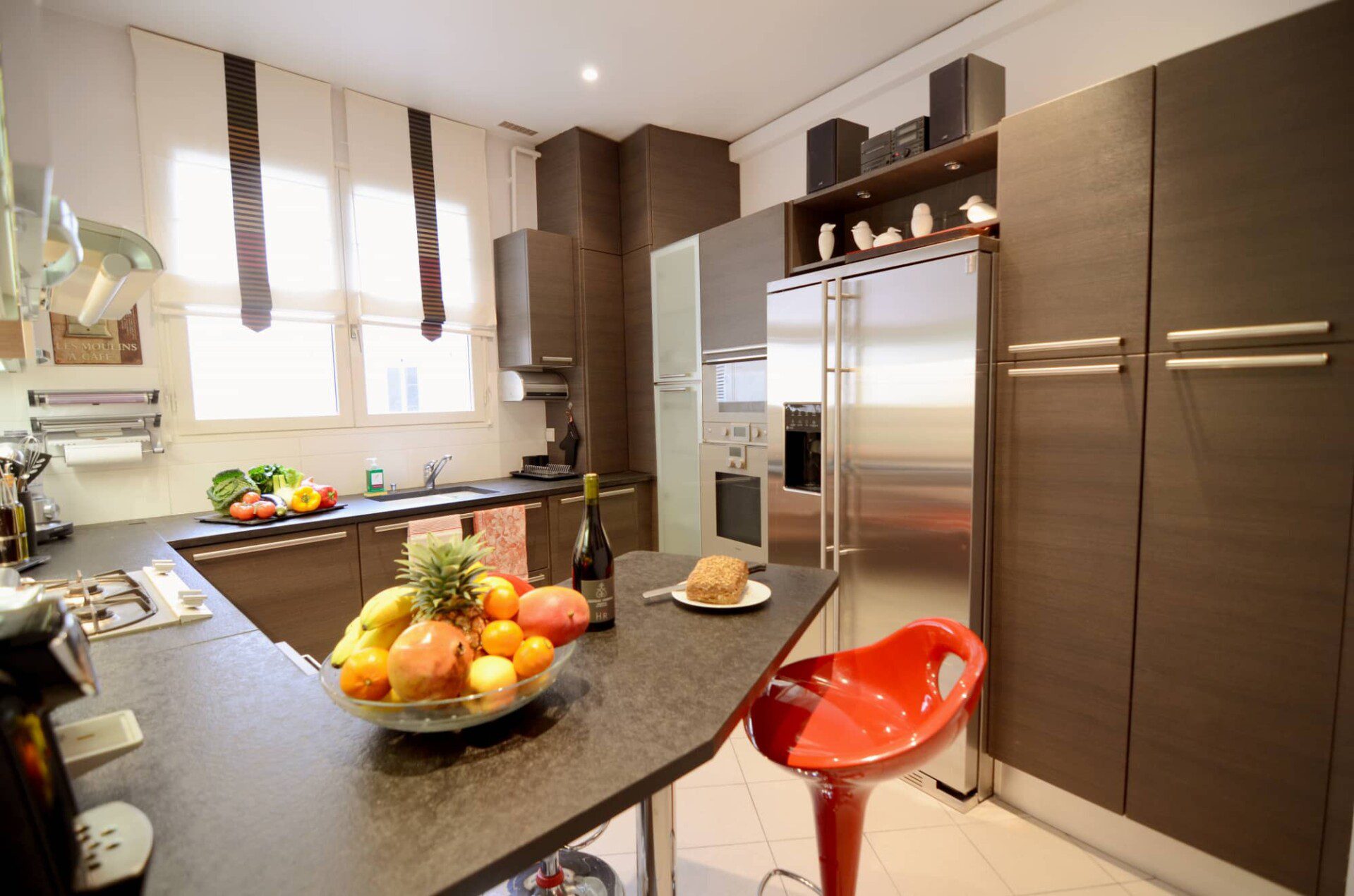 Luxury apartment near Champs-Élysées Paris – fully equipped kitchen with dark worktop