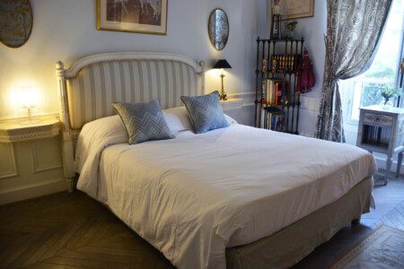 Luxury duplex near Eiffel Tower Paris – double bedroom with grey upholstered headboard
