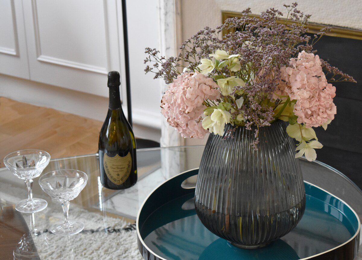 Luxury apartment near Parc Monceau Paris – champagne and flowers welcome detail