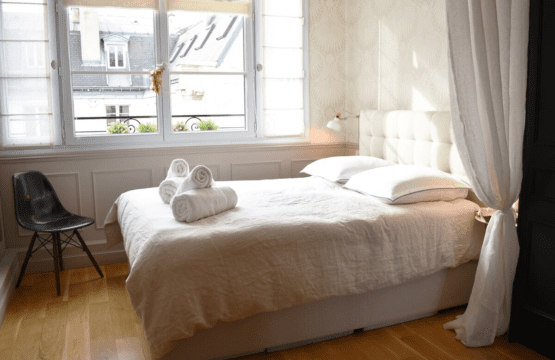 Luxury apartment near Parc Monceau Paris – bright double bedroom with natural light
