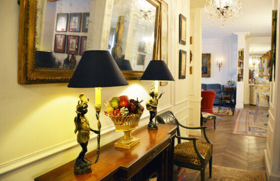 Luxury duplex near Eiffel Tower Paris – hallway with gilded console table and artwork