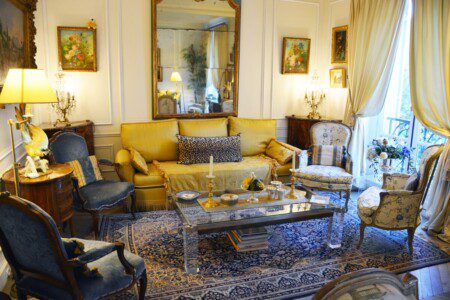Luxury duplex near Eiffel Tower Paris – grand living room with yellow sofas and Persian rug