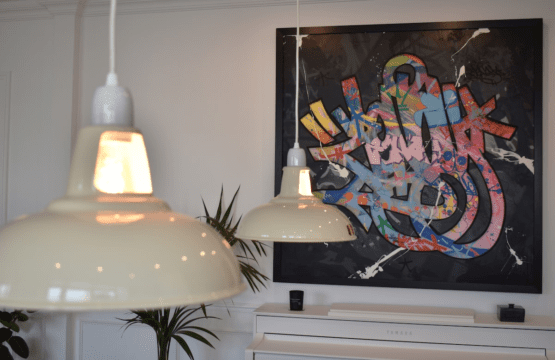 Luxury apartment near Parc Monceau Paris – pendant lamps and graffiti artwork detail